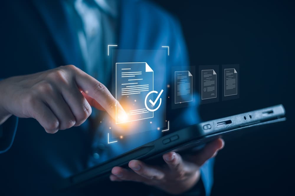 man-holding-tablet–with-digital-data-concept